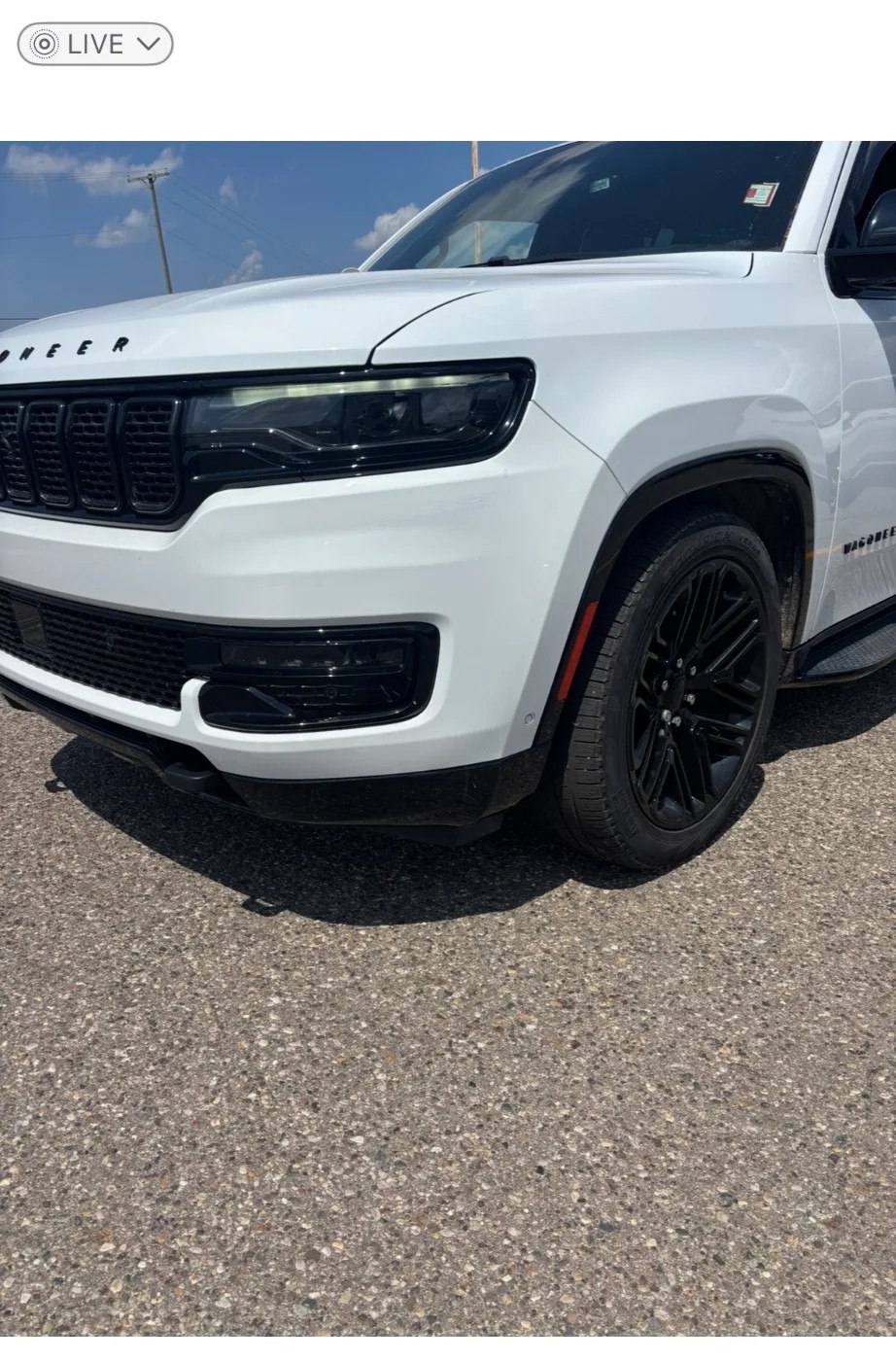 Fully restored white Jeep with pristine finish