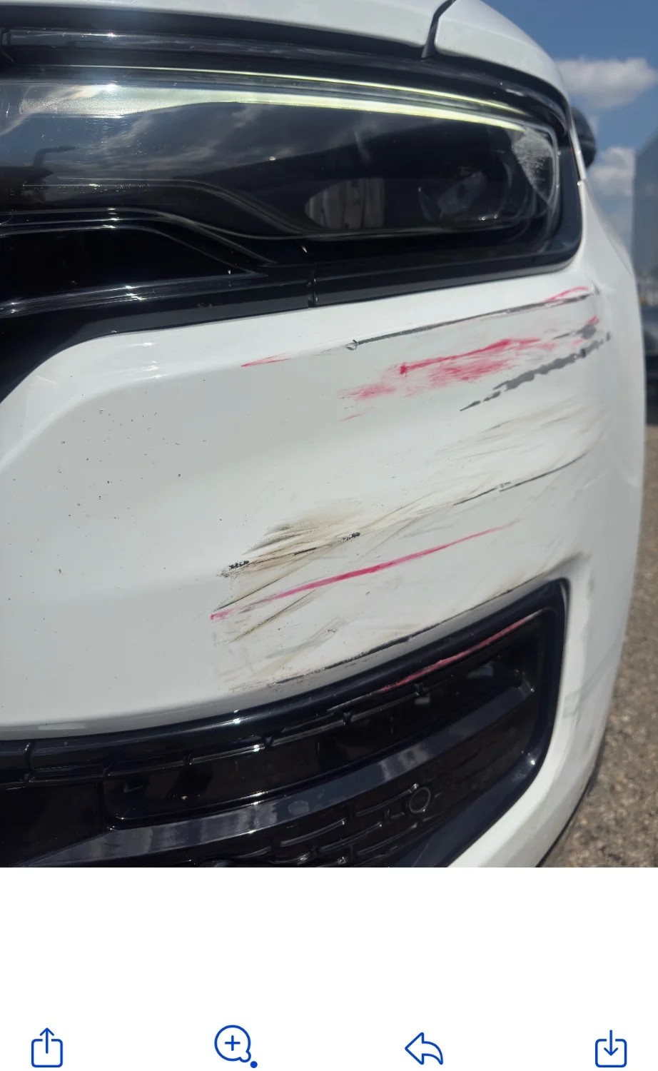 Hood with scratches and red paint transfer before restoration