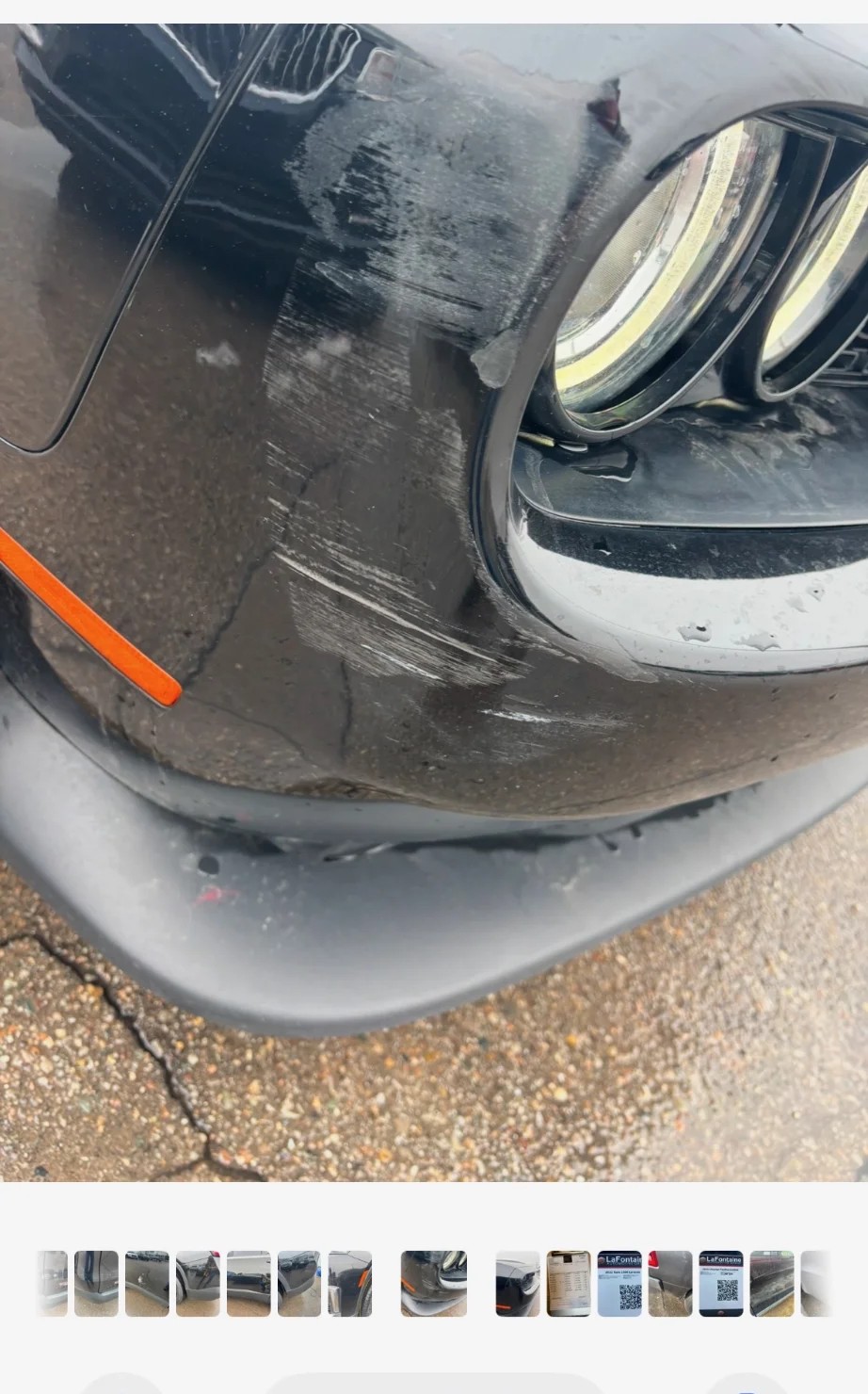 Black bumper with heavy scratches and damage